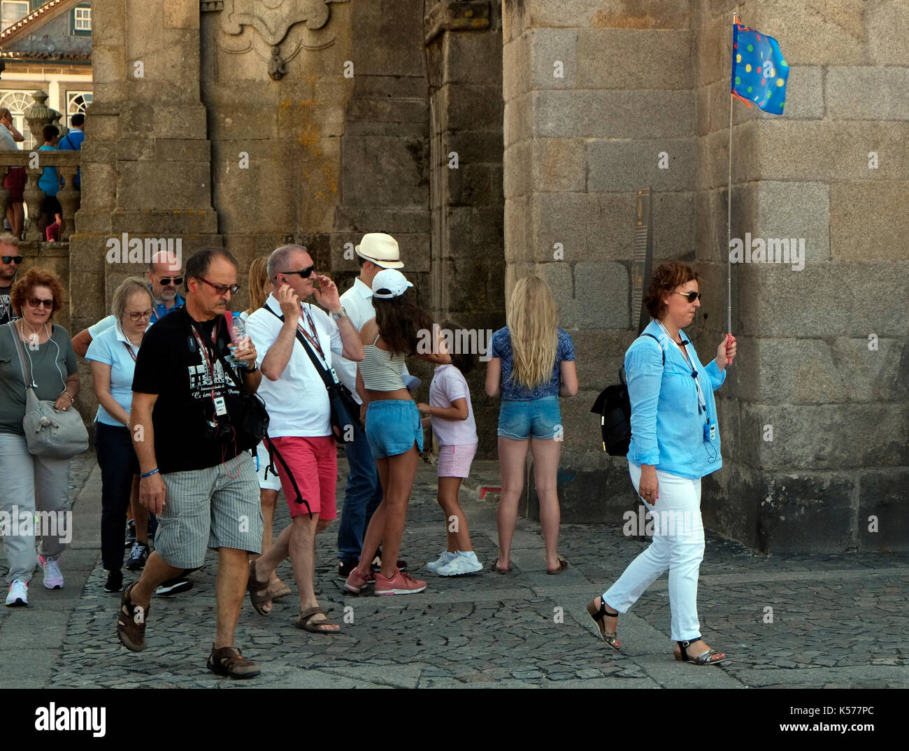 A tour guide leads a party of tourists at Porto Cathedral, in Portugal August 20, 2017. © John Voos Stock Photo