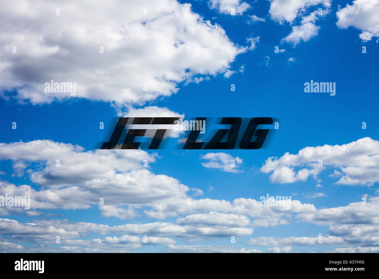 Jet lag writing on blue cloudy sky background Stock Photo