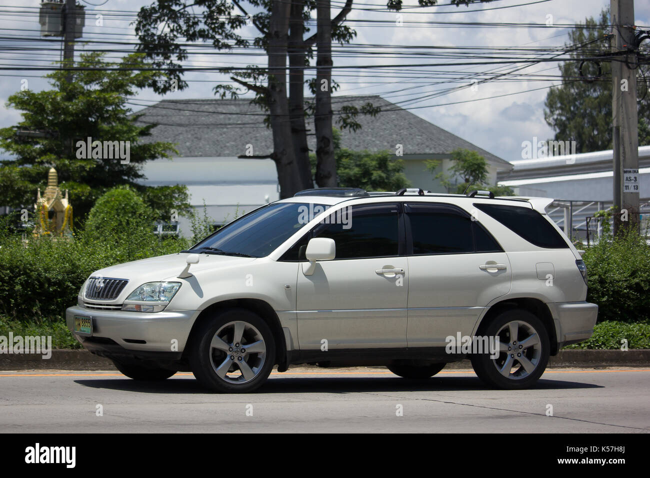 CHIANG MAI, THAILAND - AUGUST 28  2017:   Private Green car Lexus RX300. Photo at road no.1001 about 8 km from downtown Chiangmai, thailand. Stock Photo
