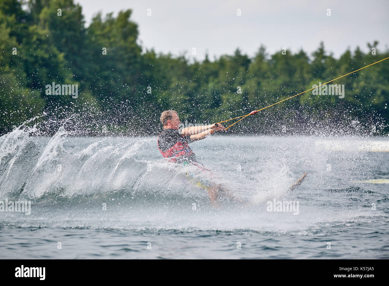 hot ride of a young boy driving water ski Stock Photo
