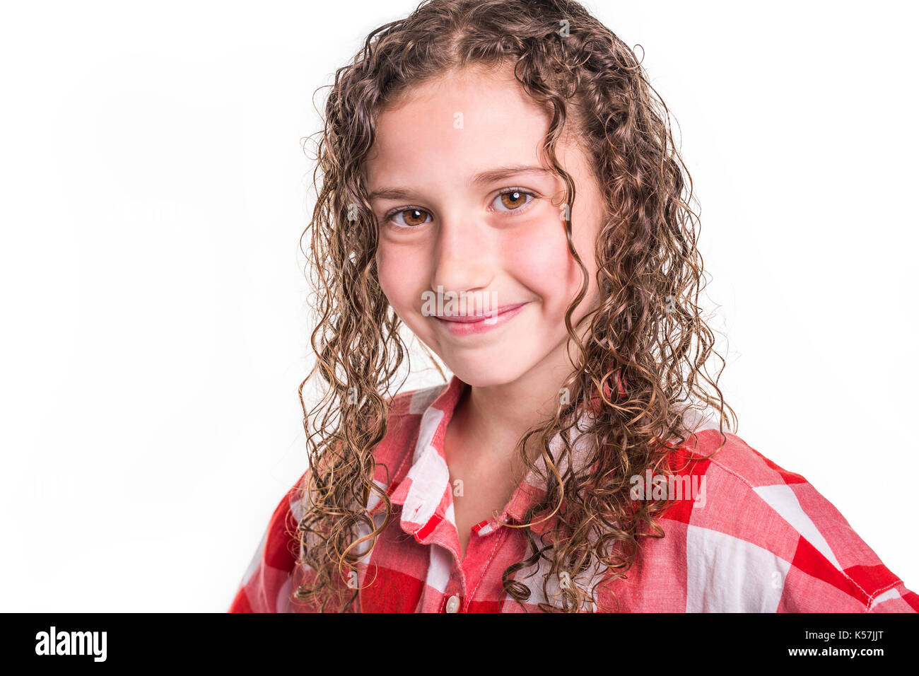 Portrait Of 9 Years Old Girl With Curly Hair Isolated On White