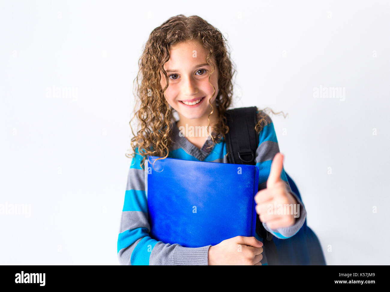 girl of 9 years in a school uniform poses in studio Stock Photo - Alamy