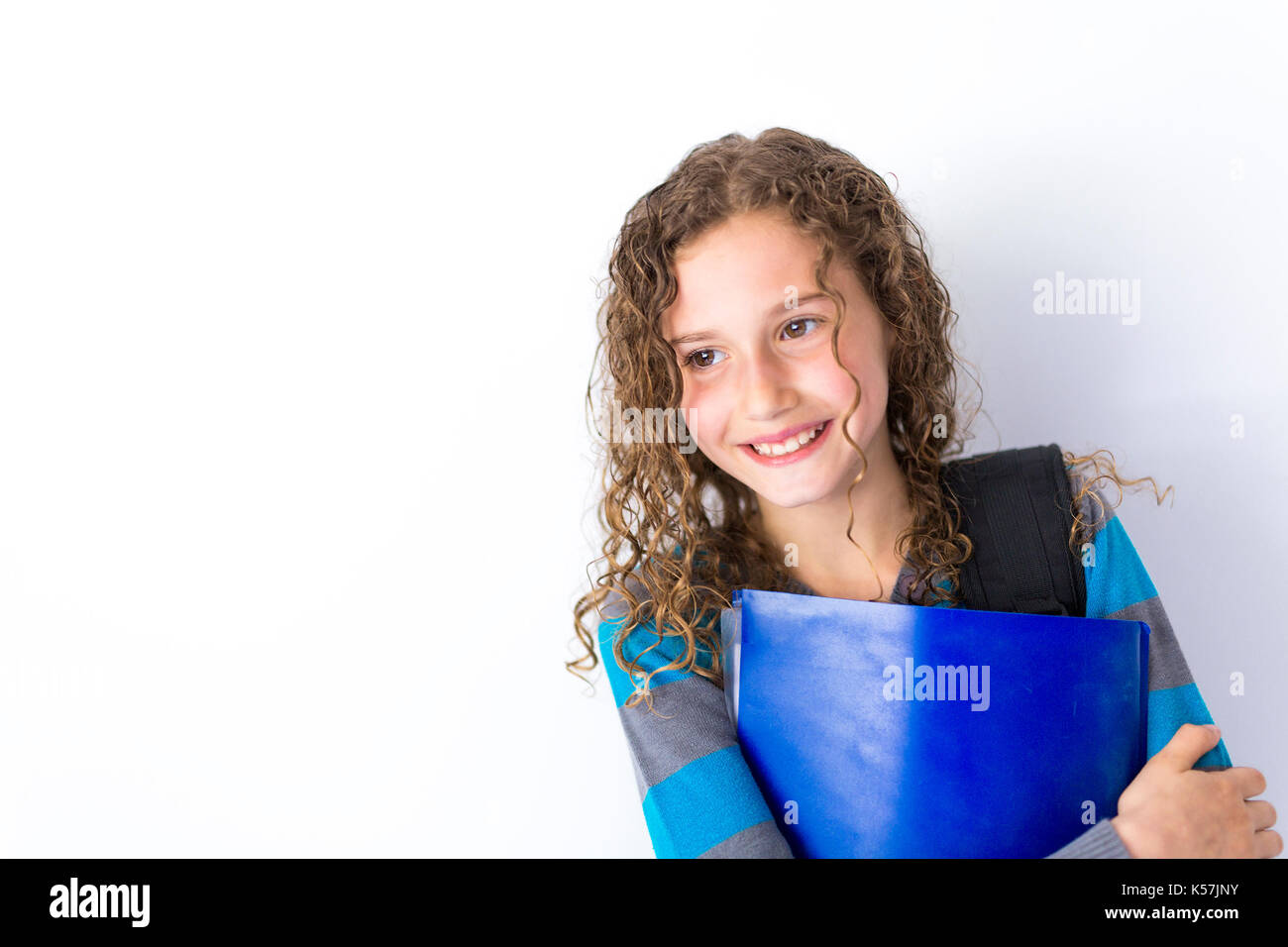 girl of 9 years in a school uniform poses in studio Stock Photo - Alamy