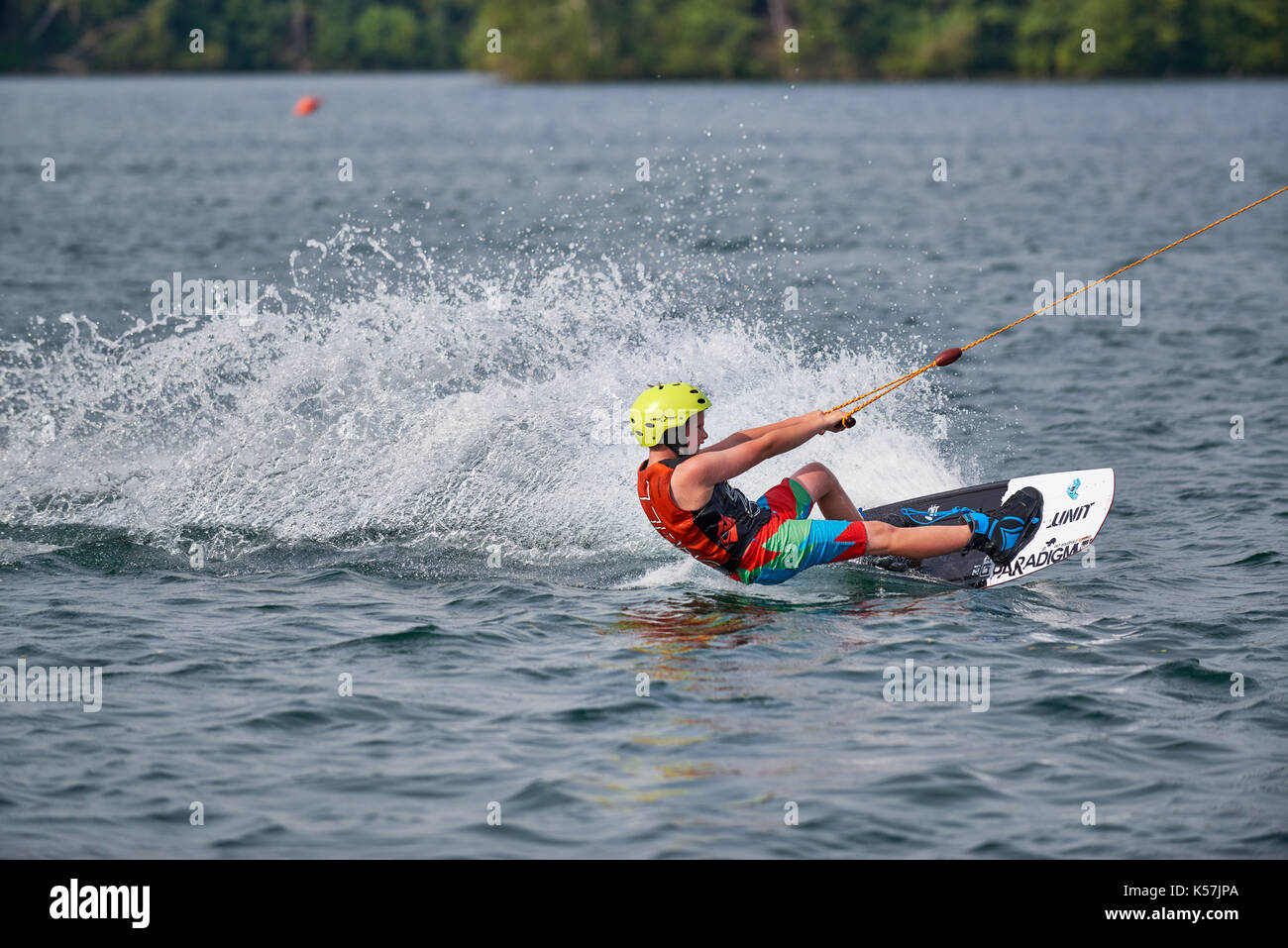 hot ride of a young boy driving water ski Stock Photo