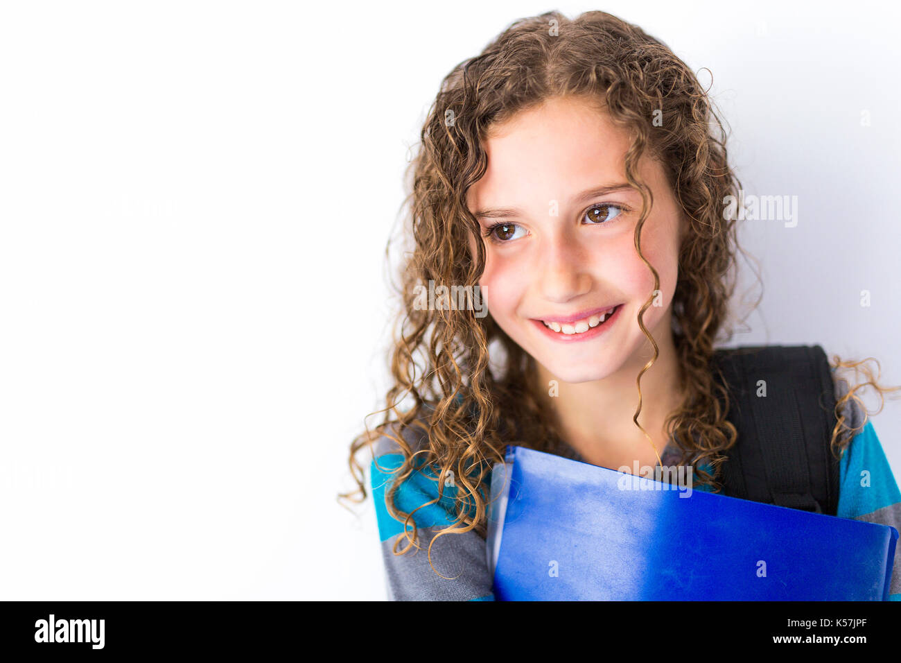 girl of 9 years in a school uniform poses in studio Stock Photo - Alamy
