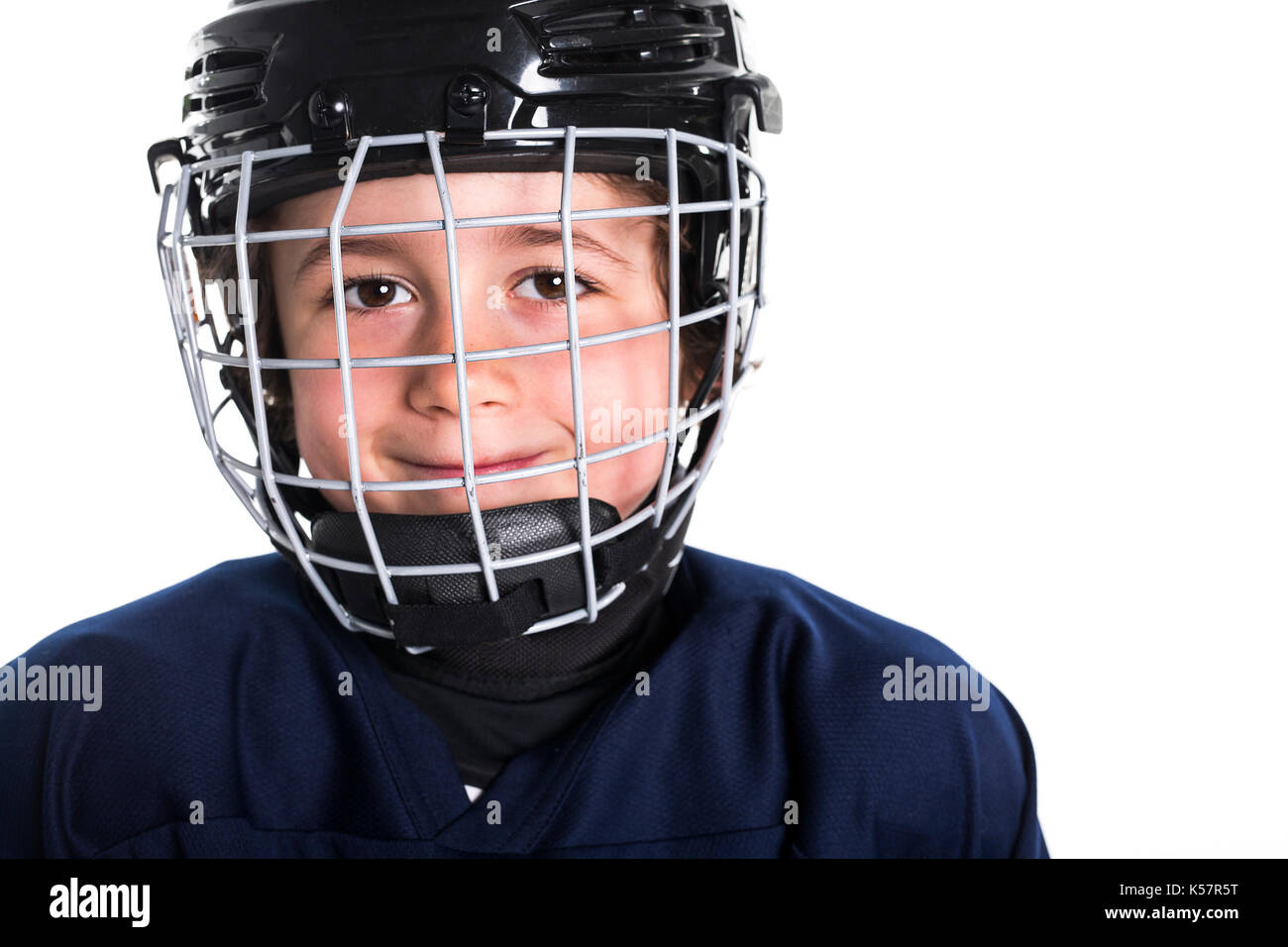 Young boy in ice hockey gear against white Stock Photo Alamy