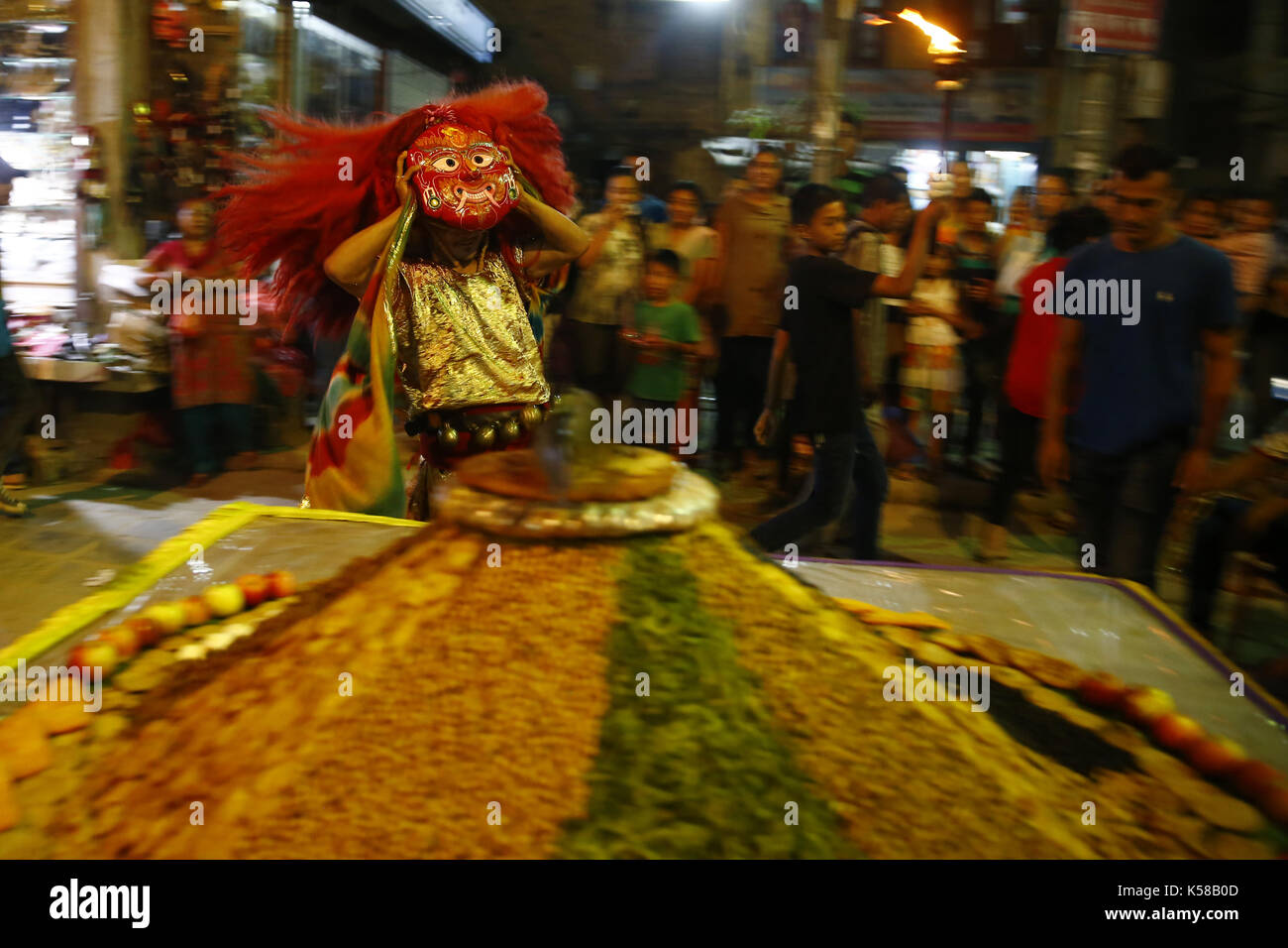 Kathmandu, Nepal. 8th Sep, 2017. A Lakhey performs before receiving ''Samyabaji'' offerings placed by devotees during Indra Jatra festival in Kathmandu, Nepal on Friday, September 08, 2017. Credit: Skanda Gautam/ZUMA Wire/Alamy Live News Stock Photo