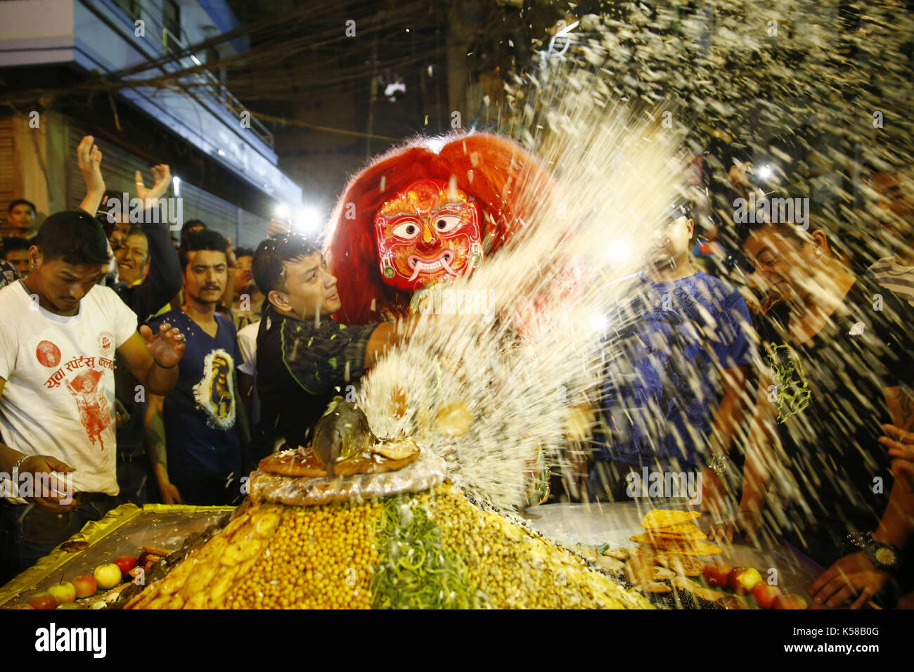 Kathmandu, Nepal. 8th Sep, 2017. A Lakhey receives ''Samyabaji'' offerings placed by devotees during Indra Jatra festival in Kathmandu, Nepal on Friday, September 08, 2017. Credit: Skanda Gautam/ZUMA Wire/Alamy Live News Stock Photo