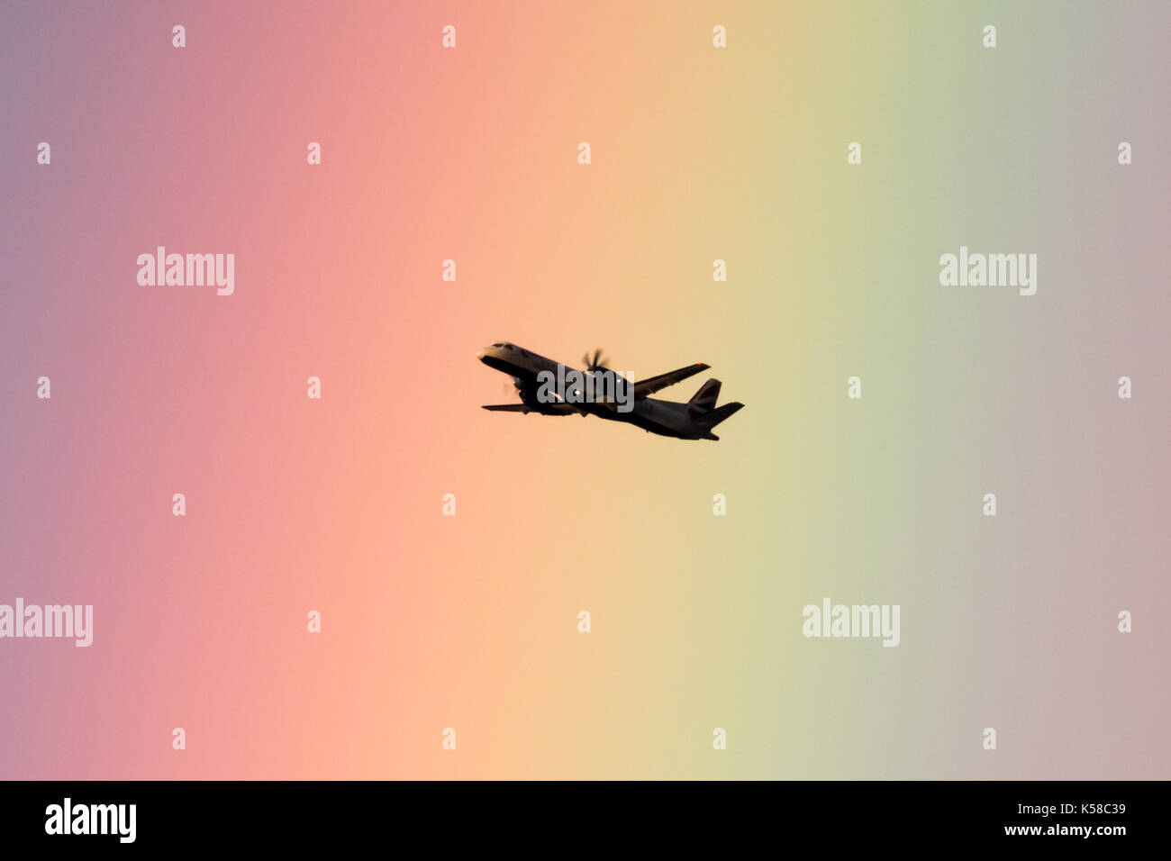 London, UK. 8th Sep, 2017. UK Weather: A British Airways passenger plane leaving City Airport passes through a sunset rainbow over the city. Credit: Guy Corbishley/Alamy Live News Stock Photo