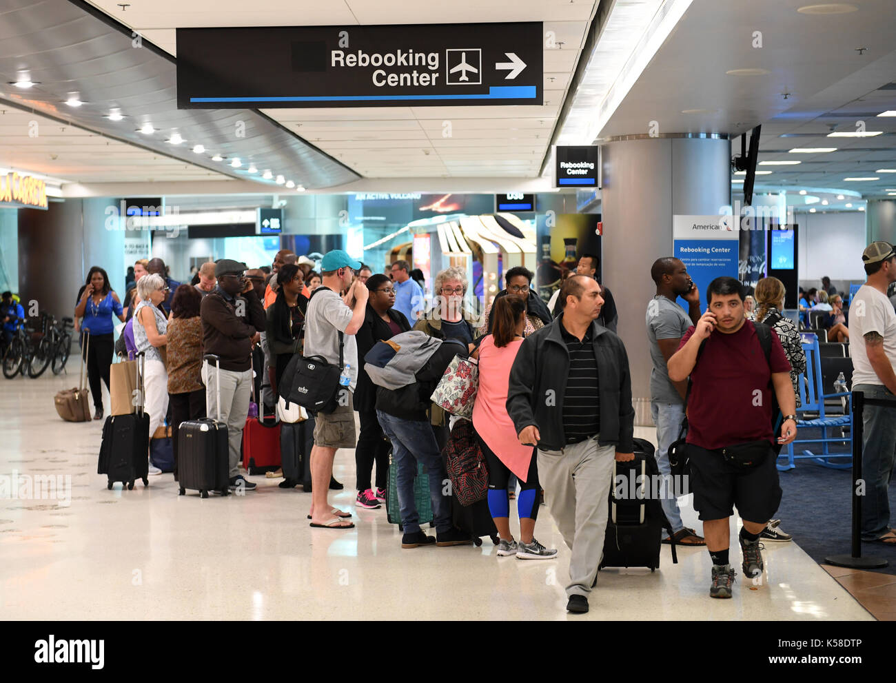 170908) -- MIAMI (U.S.), Sept. 8, 2017 (Xinhua) -- Passengers queue to  rebook their flights which have been canceled due to the effect of  hurricane "Irma" at Miami International Airport in Miami,