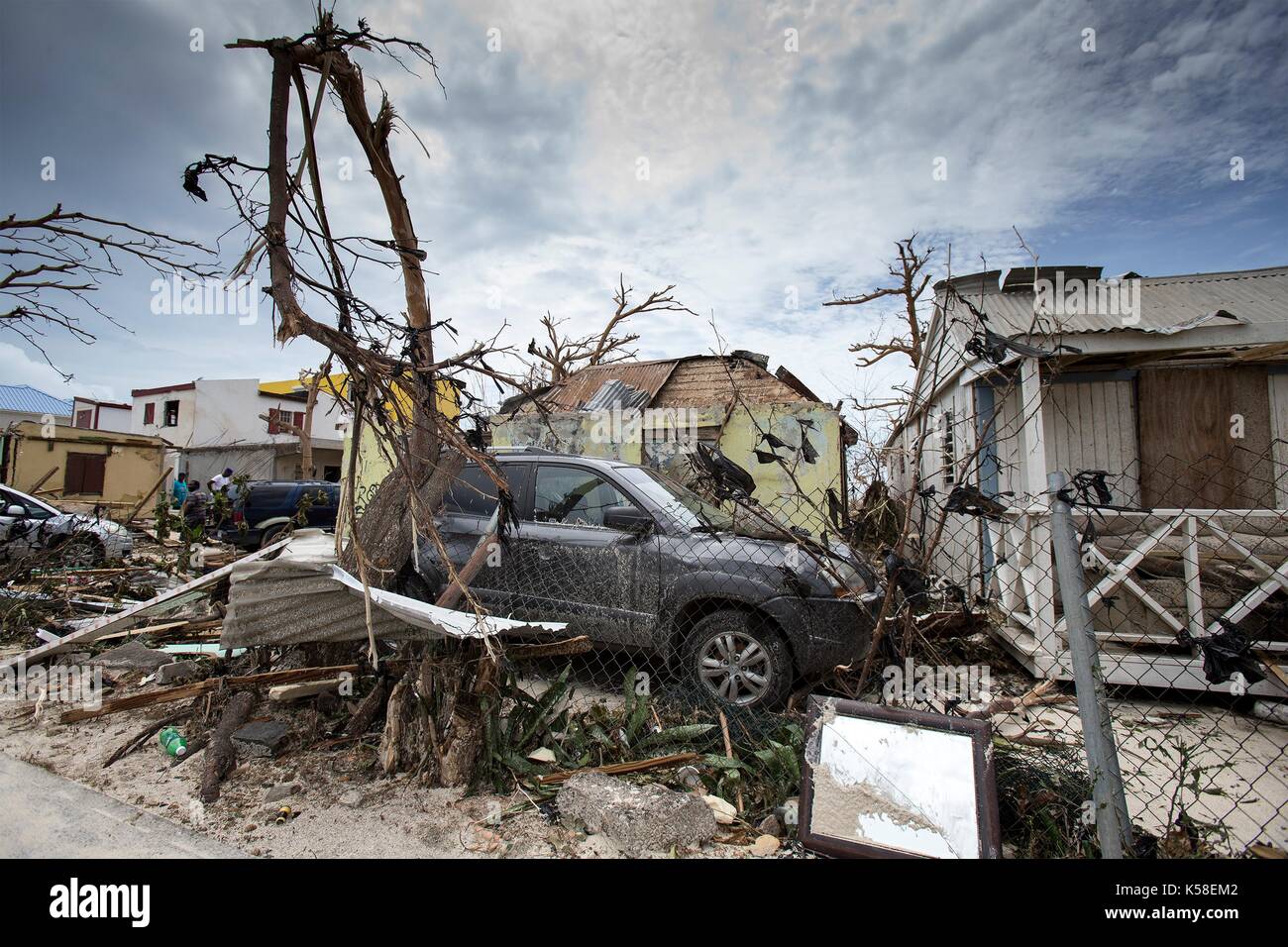 Vehicles and debris from destroyed homes litter the historic district on the Dutch island of St Maarten following a direct hit by Hurricane Irma, a Category 5 storm lashing the Caribbean September 7, 2017 in Philipsburg, St. Maarten. Stock Photo