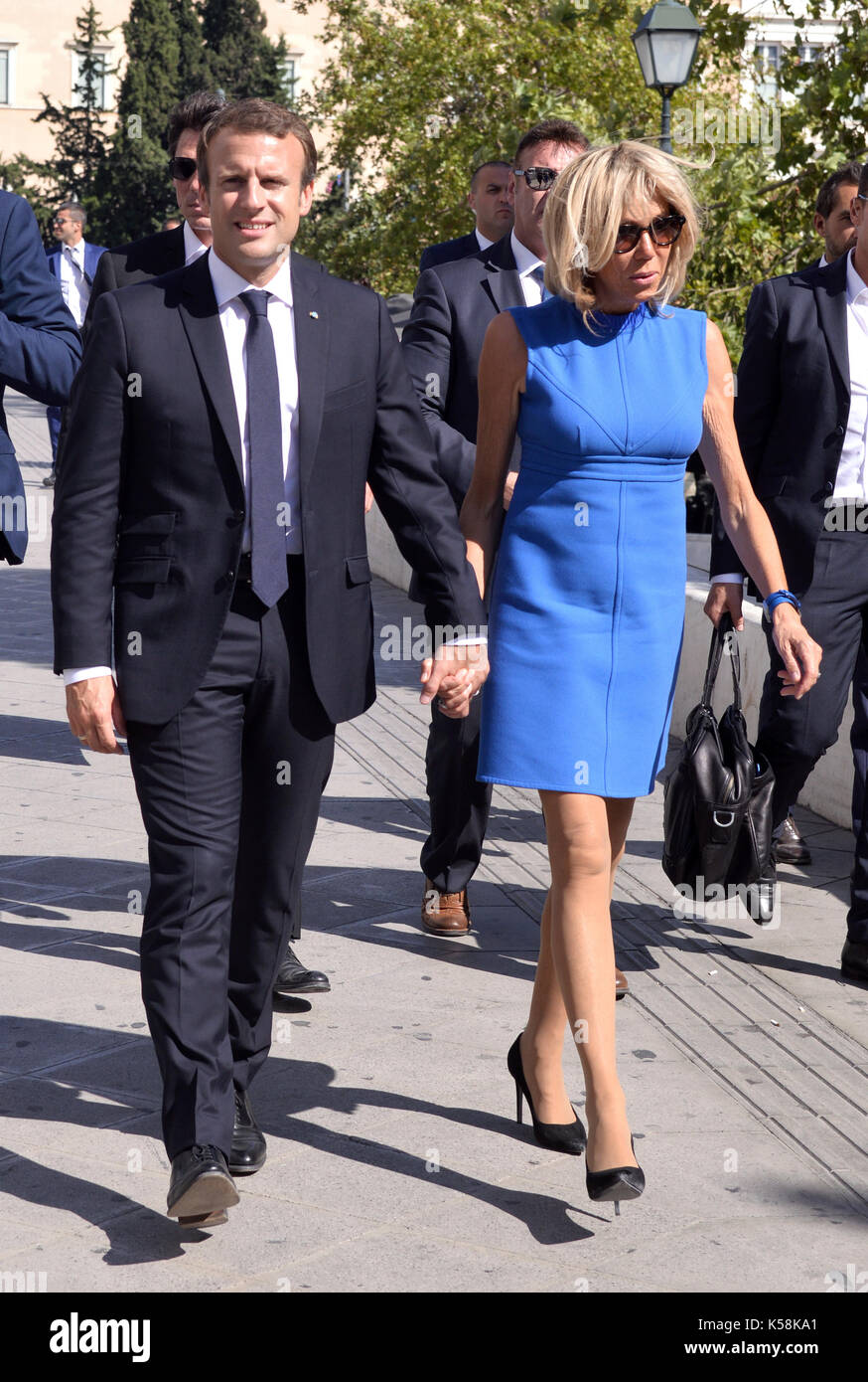 Athens, Greece. 08 Sep., 2017. French President Emmanuel Makron (L) walks hand by hand with his wife Brigitte Makron in Syntagma square, central Athens, Greece, 08 September 2017, accompanied by his bodyguards. Makron came to Greece on a two-day official visit. ©Elias Verdi/Alamy Live News Stock Photo