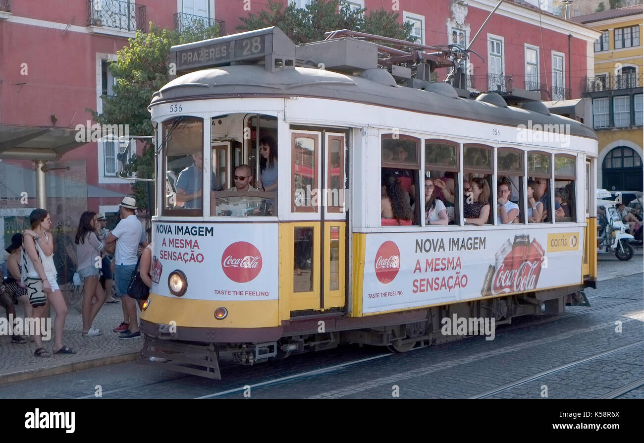 Passengers ride in a tram in Lisbon, Portugal August 25, 2017. © John Voos Stock Photo