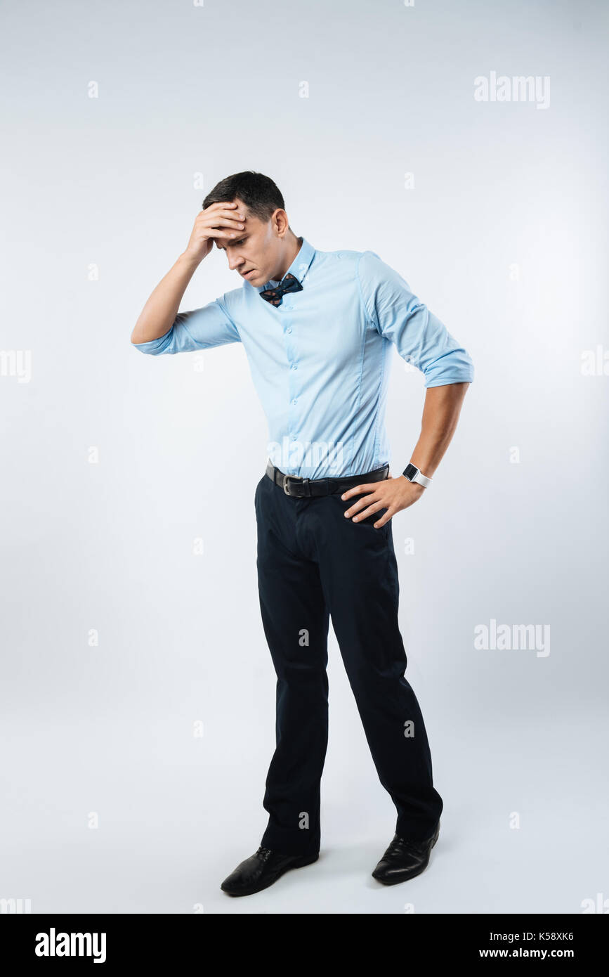 Cheerless sad man feeling depressed Stock Photo