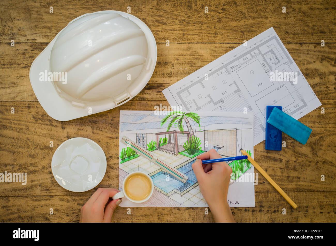 Woman working, projecting on table, architect, engineer. Stock Photo