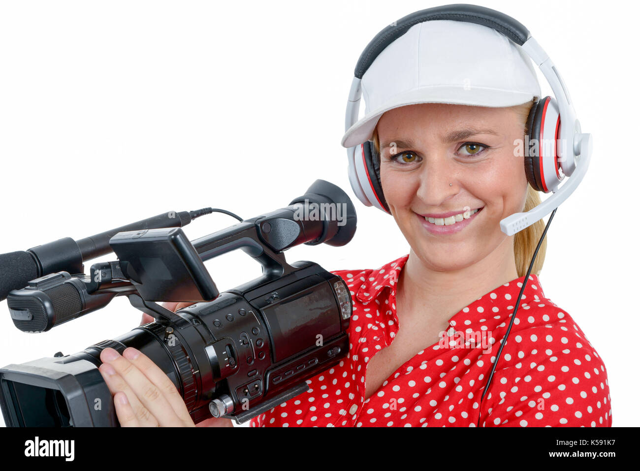 a beautiful young woman with a professional video camera and headphone