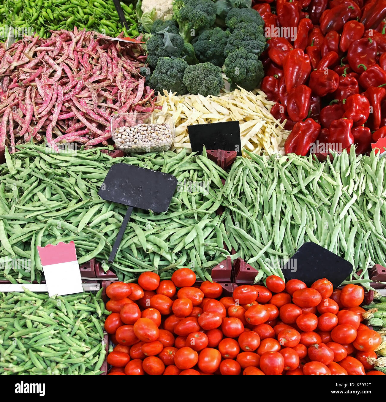 Fresh organic vegetables in piles on market stall Stock Photo - Alamy