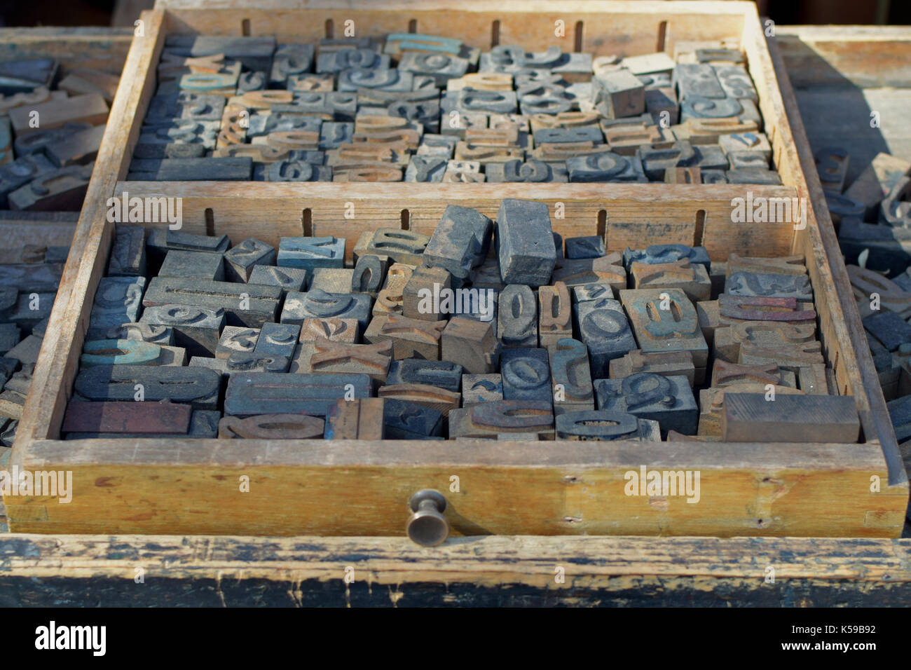 Box of antique wooden letters printing blocks letterpress type set. Abstract typography
