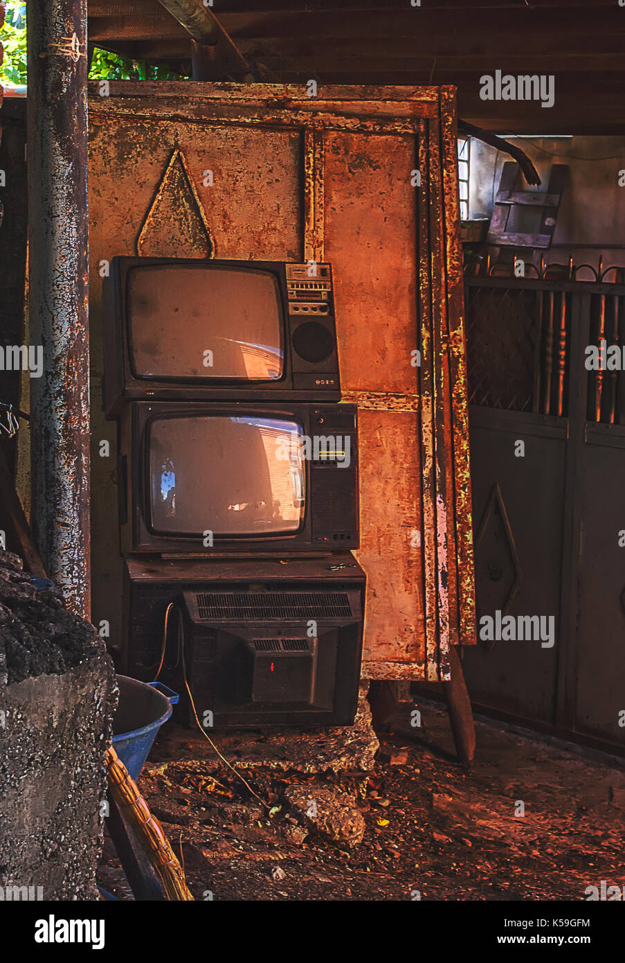 Vintage old television TV sets broken and ruined inside abandoned house Stock Photo