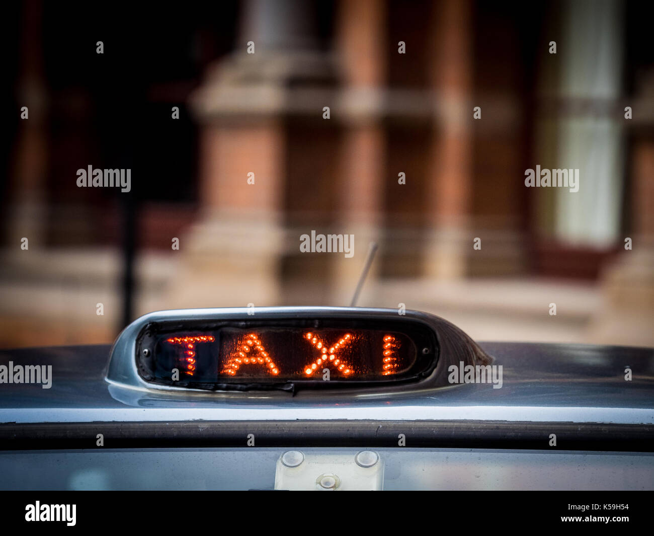 Taxi for hire sign on an older model London Taxi / Black Cab Stock Photo
