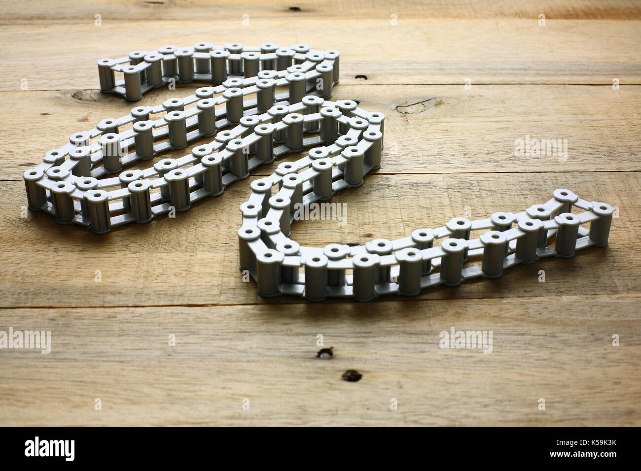 Bicycle Chain on Wooden Chain Stock Photo