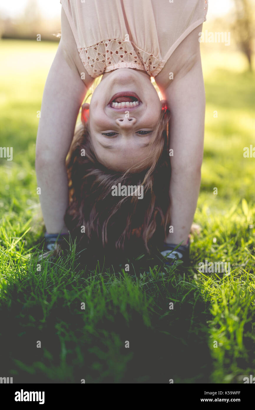 Happy child playing park grass hi-res stock photography and images - Alamy