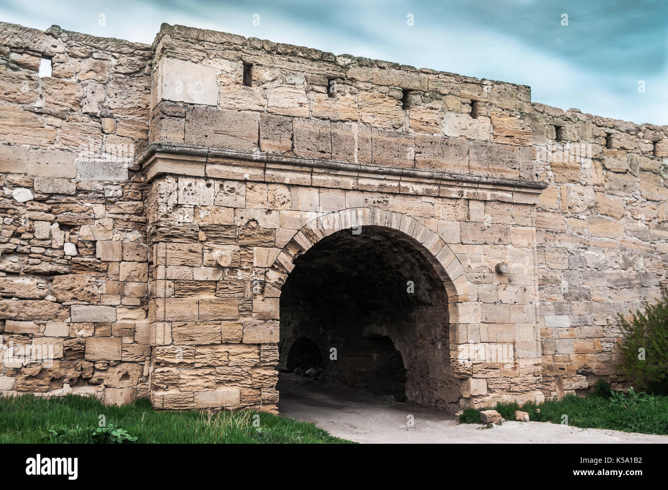 The medieval ruins of the fortress. The passage in the form of an arch ...