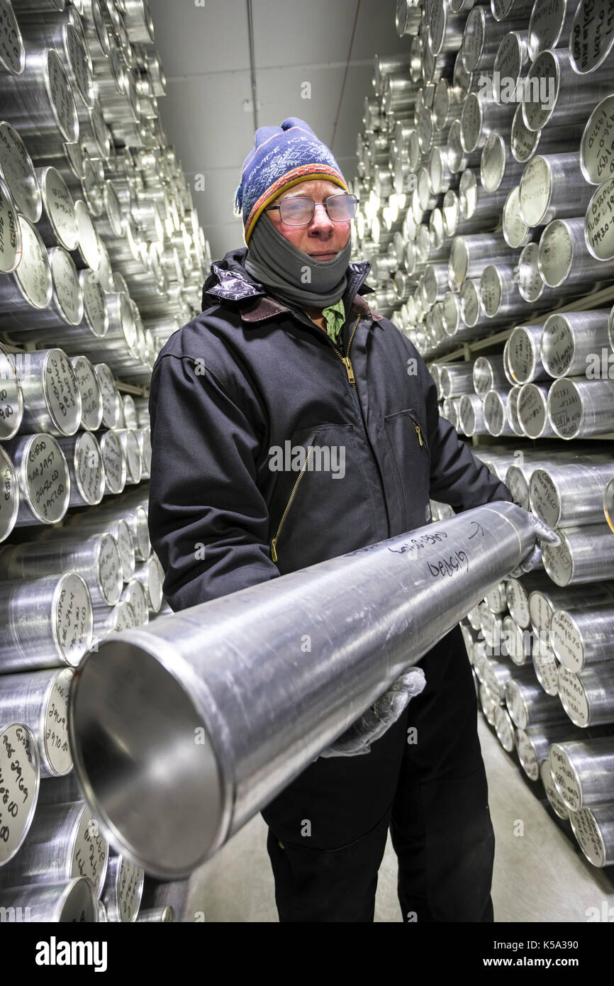 Denver, Colorado - Geoff Hargreaves, curator at the National Ice Core Laboratory, holds a one-meter section of an ice core stored at -36 degrees C (-3 Stock Photo