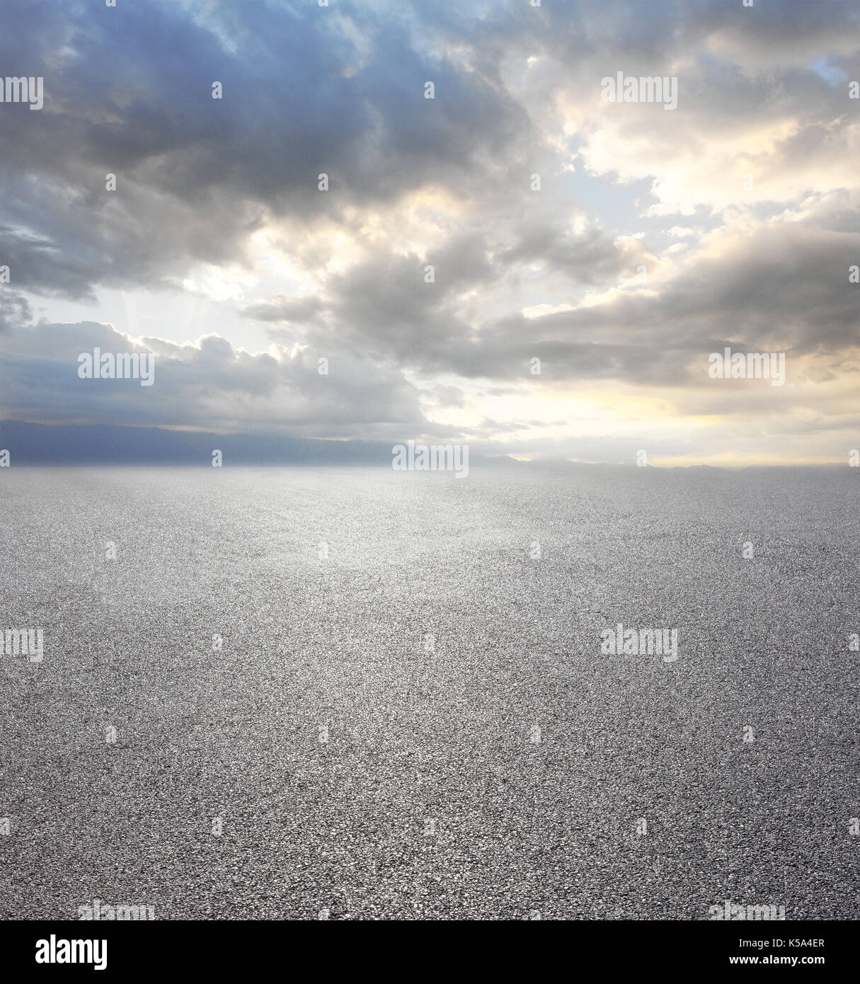 Asphalt road with cloudy sky and mountain background Stock Photo - Alamy