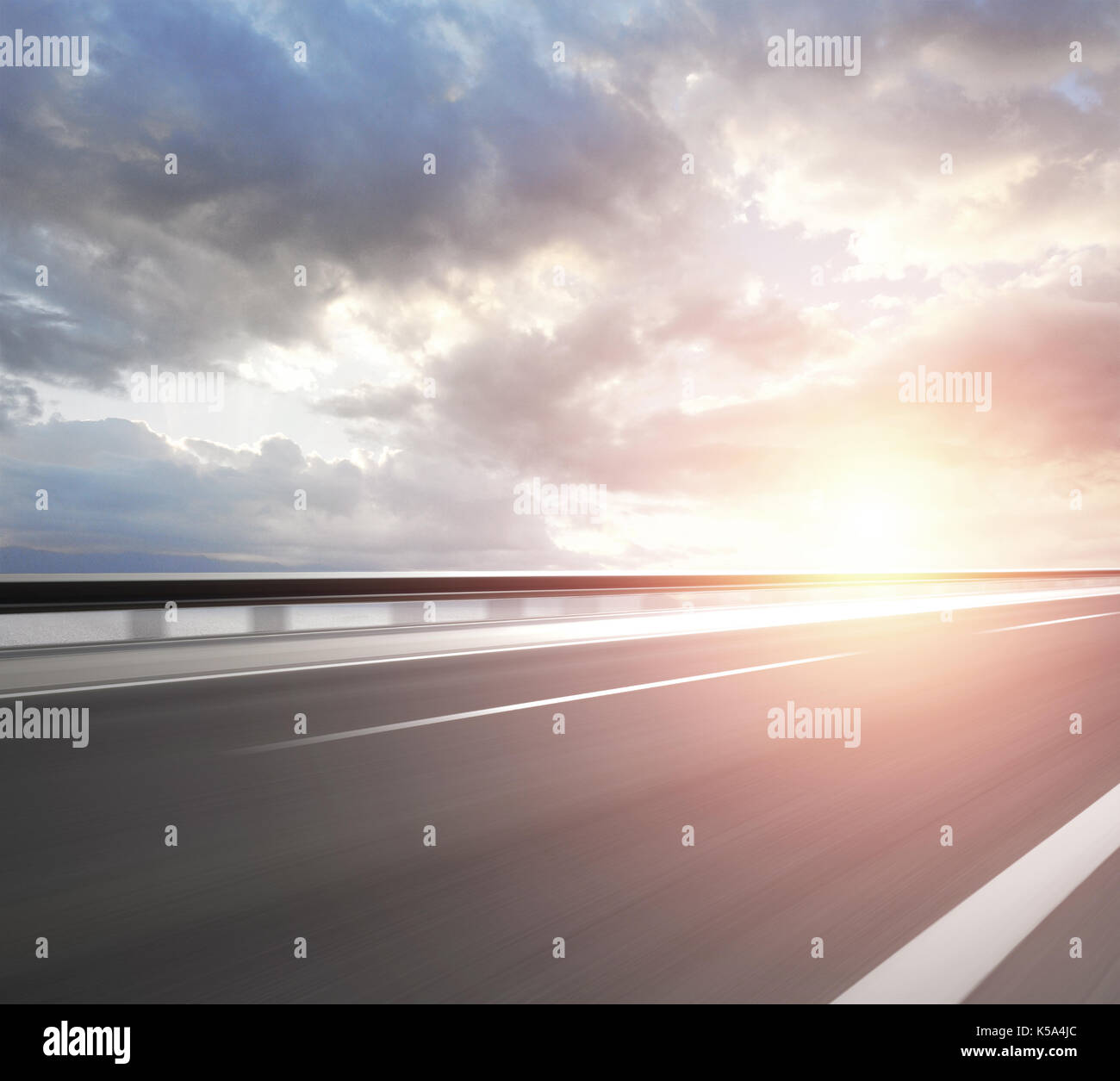 Asphalt road with cloudy sky and mountain background Stock Photo - Alamy