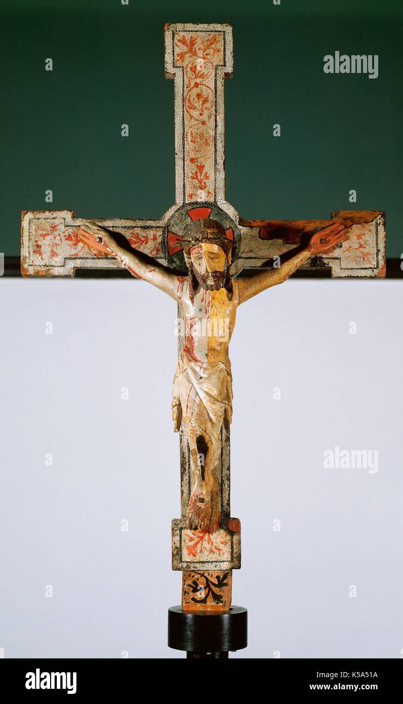 Romanesque period. Christ crucified (Christus patients). Polychromed wood. Dated at the end of 13th century. Unknown origin. Diocesan Museum of Solsona. Catalonia. Spain. Stock Photo