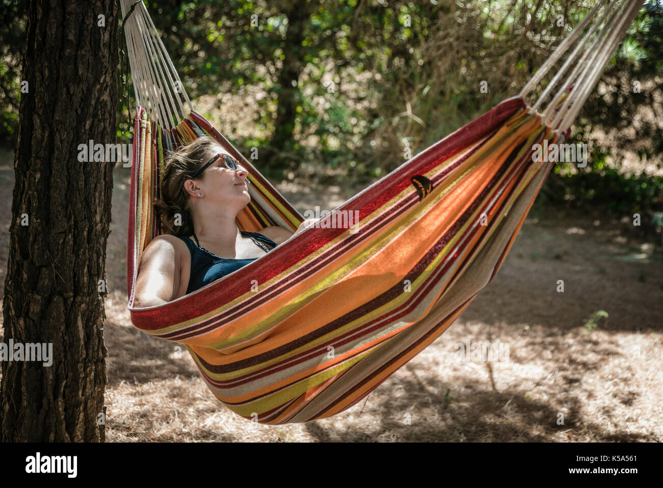 Woman swinging garden hi-res stock photography and images - Alamy