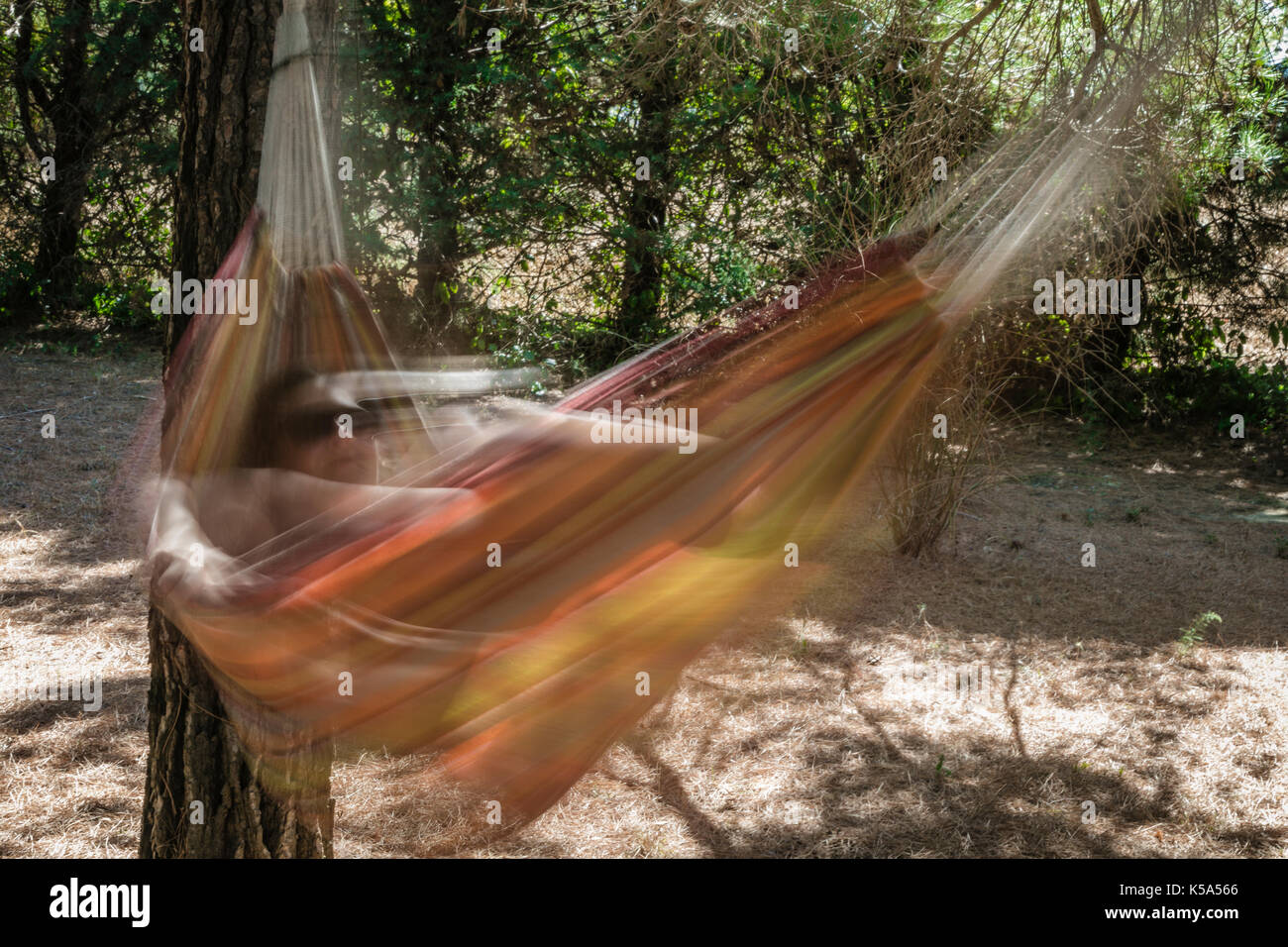 Woman swinging garden hi-res stock photography and images - Alamy