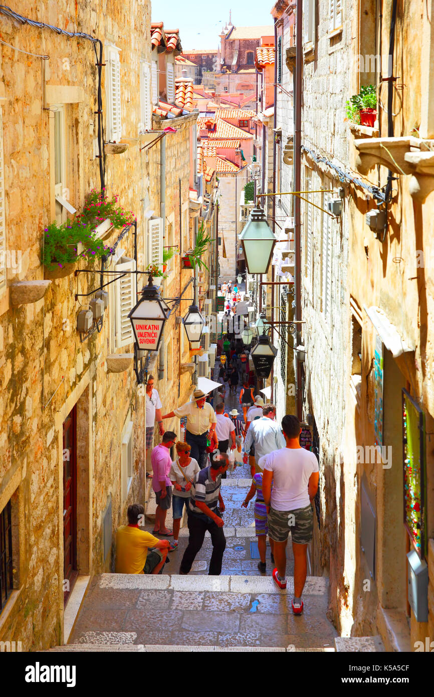 Dubrovnik, Croatia - Jine 12, 2017: People in old narrow street with stairs in Dubrovnik, Croatia Stock Photo