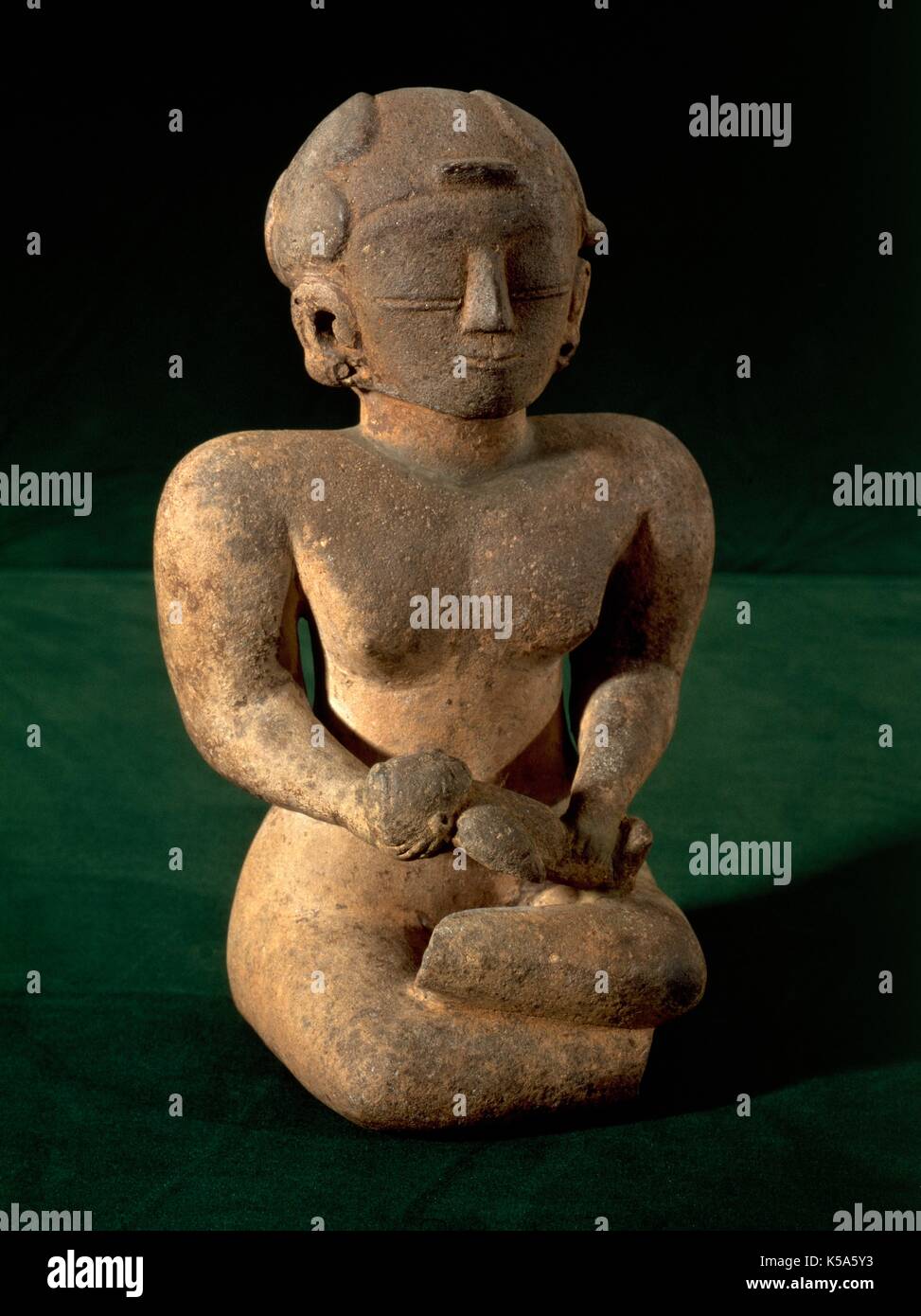 Precolumbian Art. Phase Chorrera Culture (1500 BC-500 BC). Ceramic figure. From the province of Guayas. Mother with a child in her lap. Stock Photo