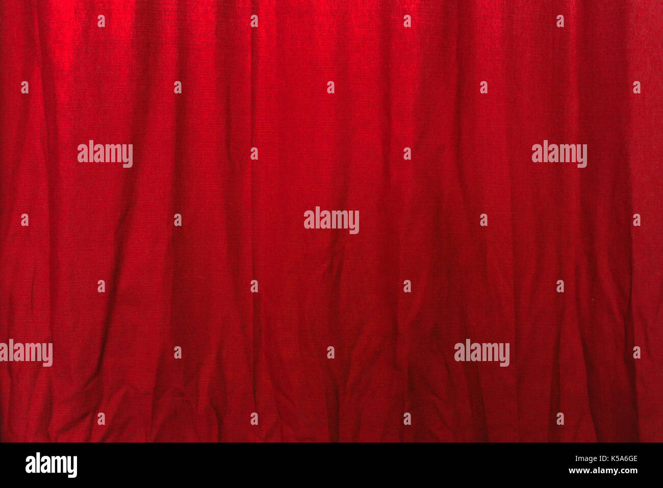 Wrinkled red curtain texture, cloth material with wrinkles as background Stock Photo