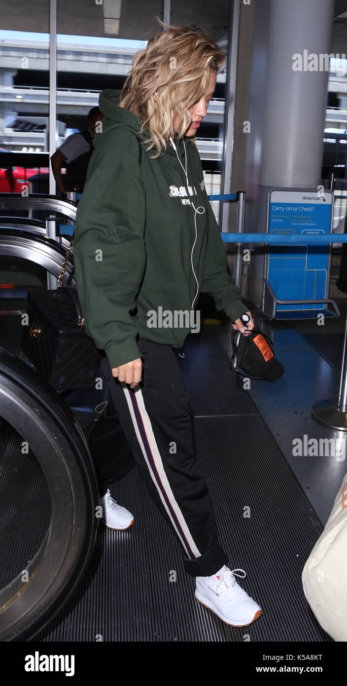 Rita Ora arrives at Los Angeles International Airport wearing baggy hoodie  and joggers outfit holding a fidget spinner Featuring: Rita Ora Where: Los  Angeles, California, United States When: 08 Aug 2017 Credit