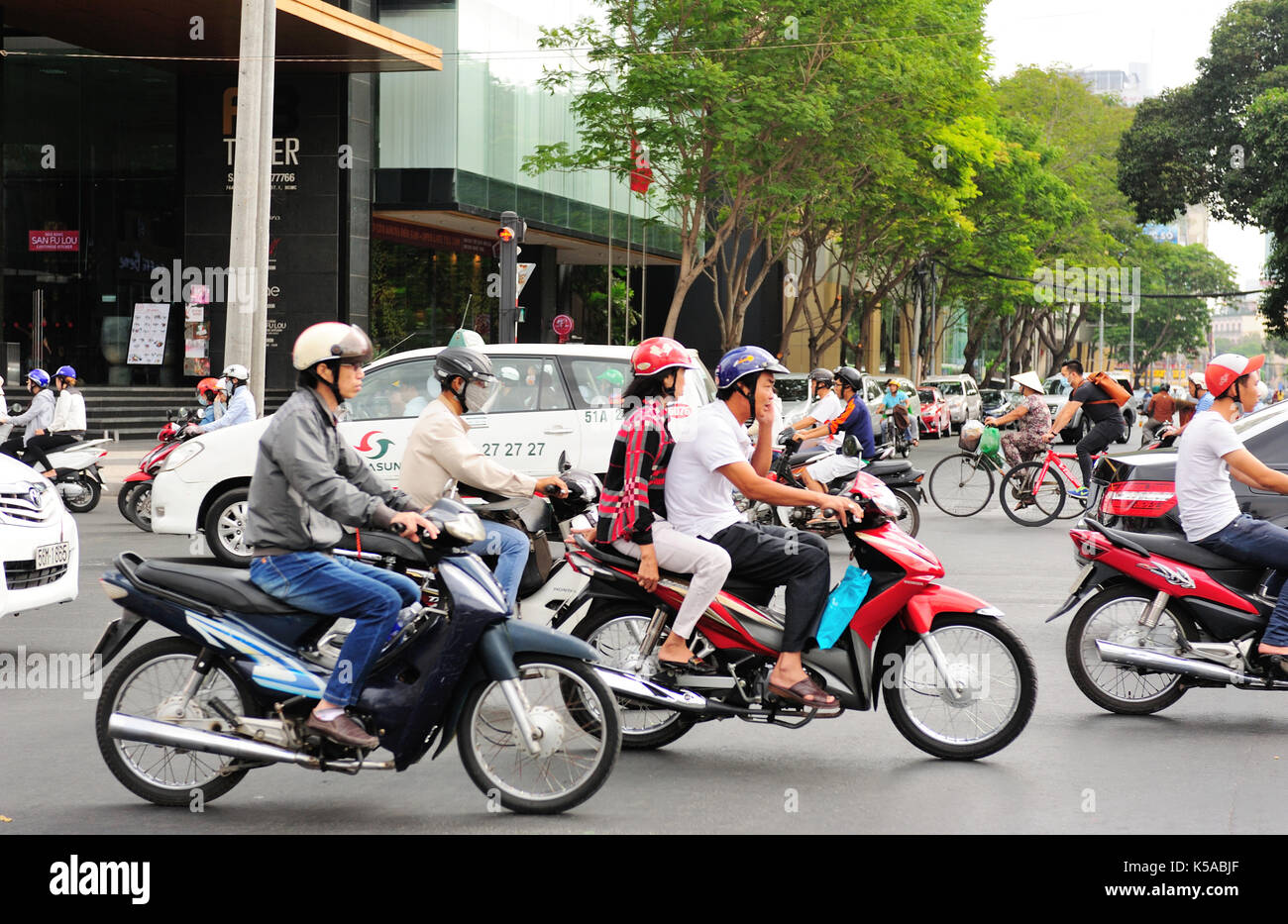 Saigon, Vietnam - Feb 25,2015: Road Traffic in Saigon (Ho Chi Minh City), Vietnam. Ho Chi Minh is the biggest city in Southern of Vietnam. Stock Photo