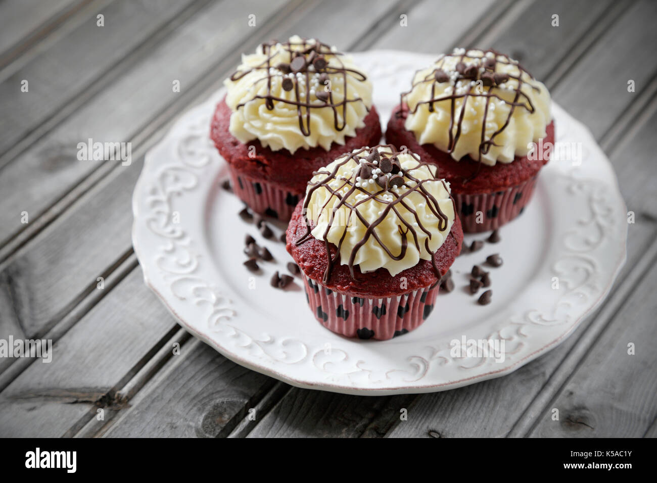 Red velvet cupcakes on gray weathered wood Stock Photo