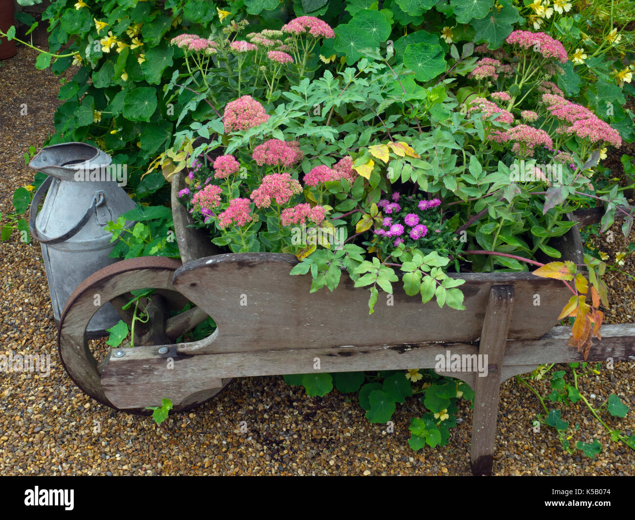 Wooden wheel barrow hires stock photography and images Alamy