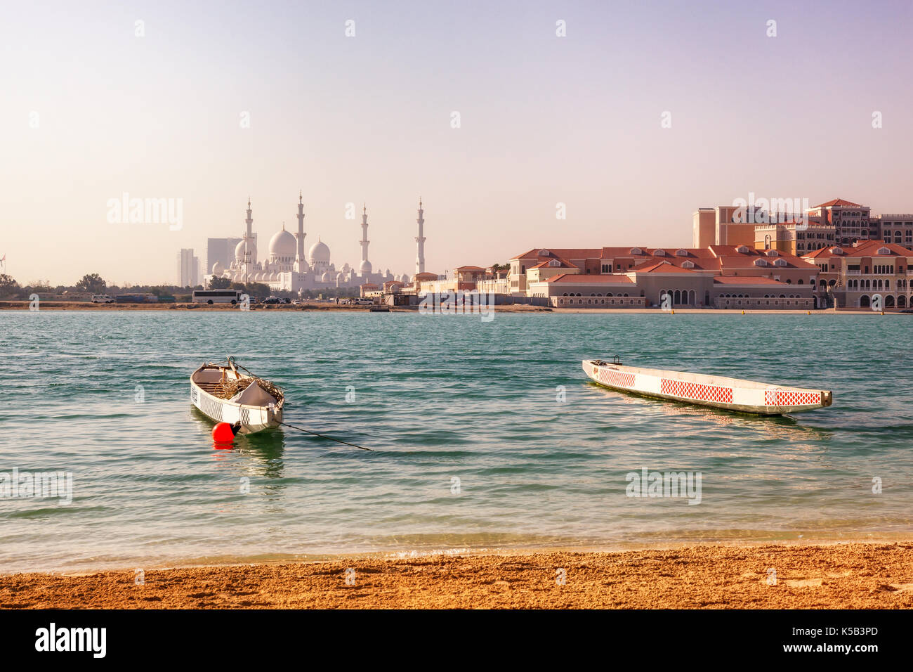 Exterior view of Grand Mosque  across the  sea, also called Sheikh Zayed Grand Mosque in Abu Dhabi, UAE Stock Photo