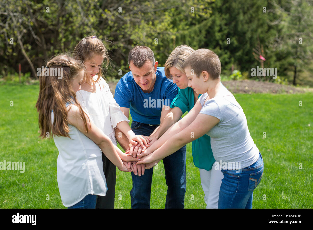 family holding hands together outside Stock Photo - Alamy