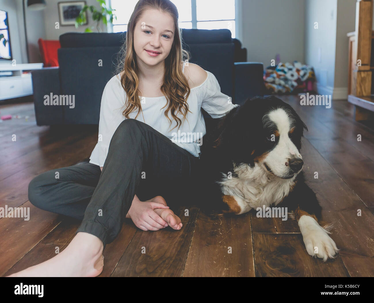 Teenage girl with dog Stock Photo