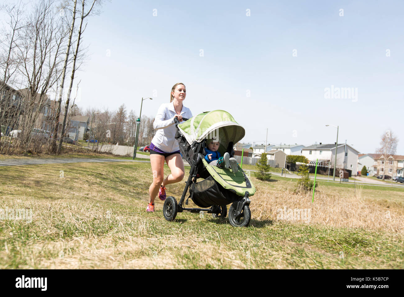 Mother doing Training, jogging with baby Stock Photo Alamy