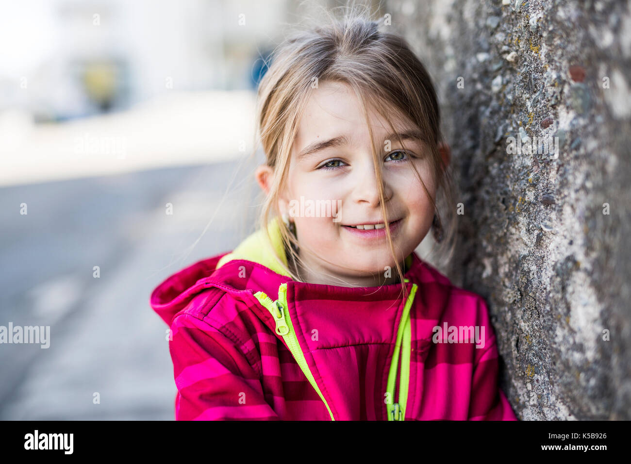 A cute Portrait of the little girl outside Stock Photo - Alamy
