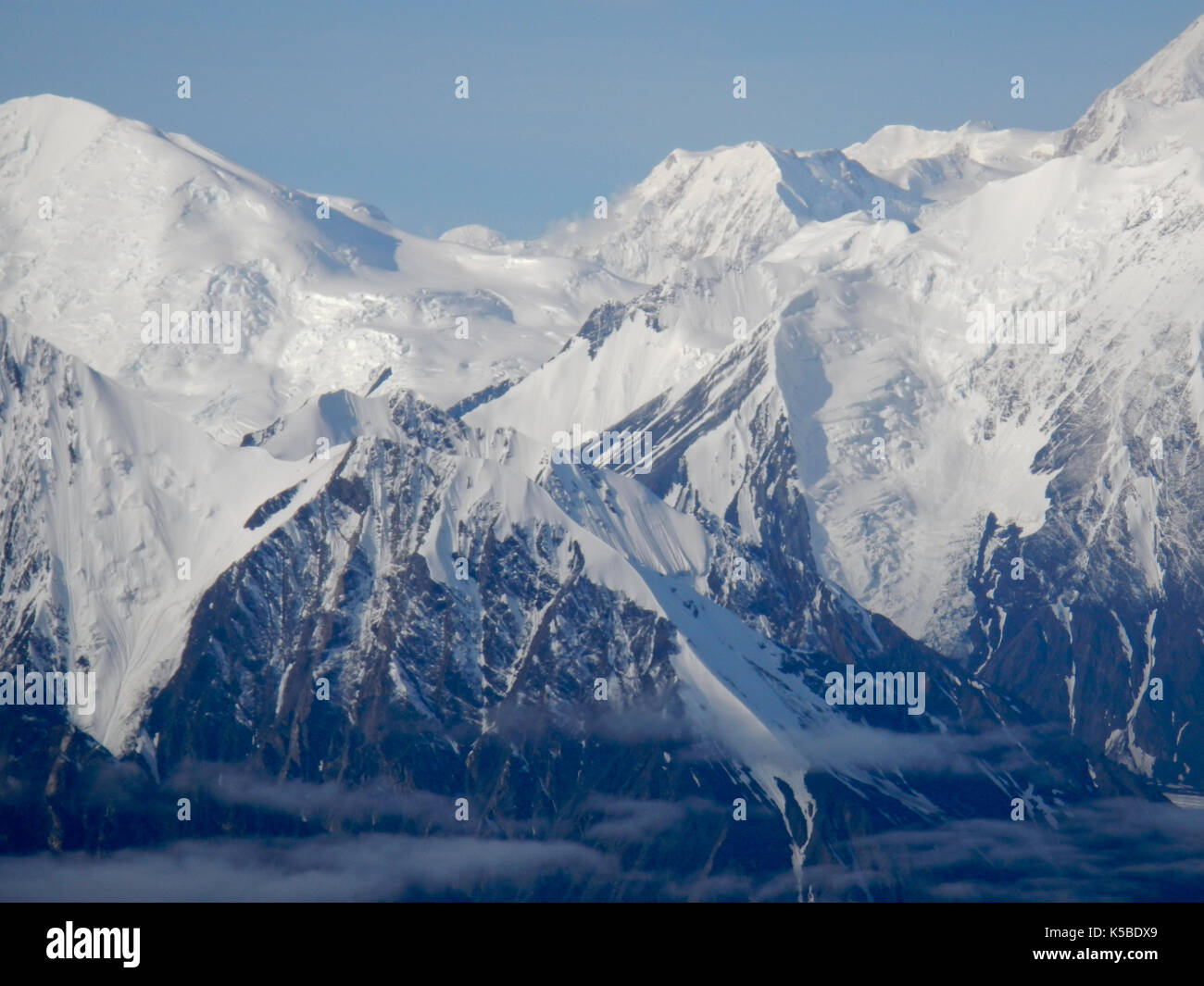 AERIAL VIEW OF SNOW CAPPED MOUNTAINS, ALASKA Stock Photo - Alamy