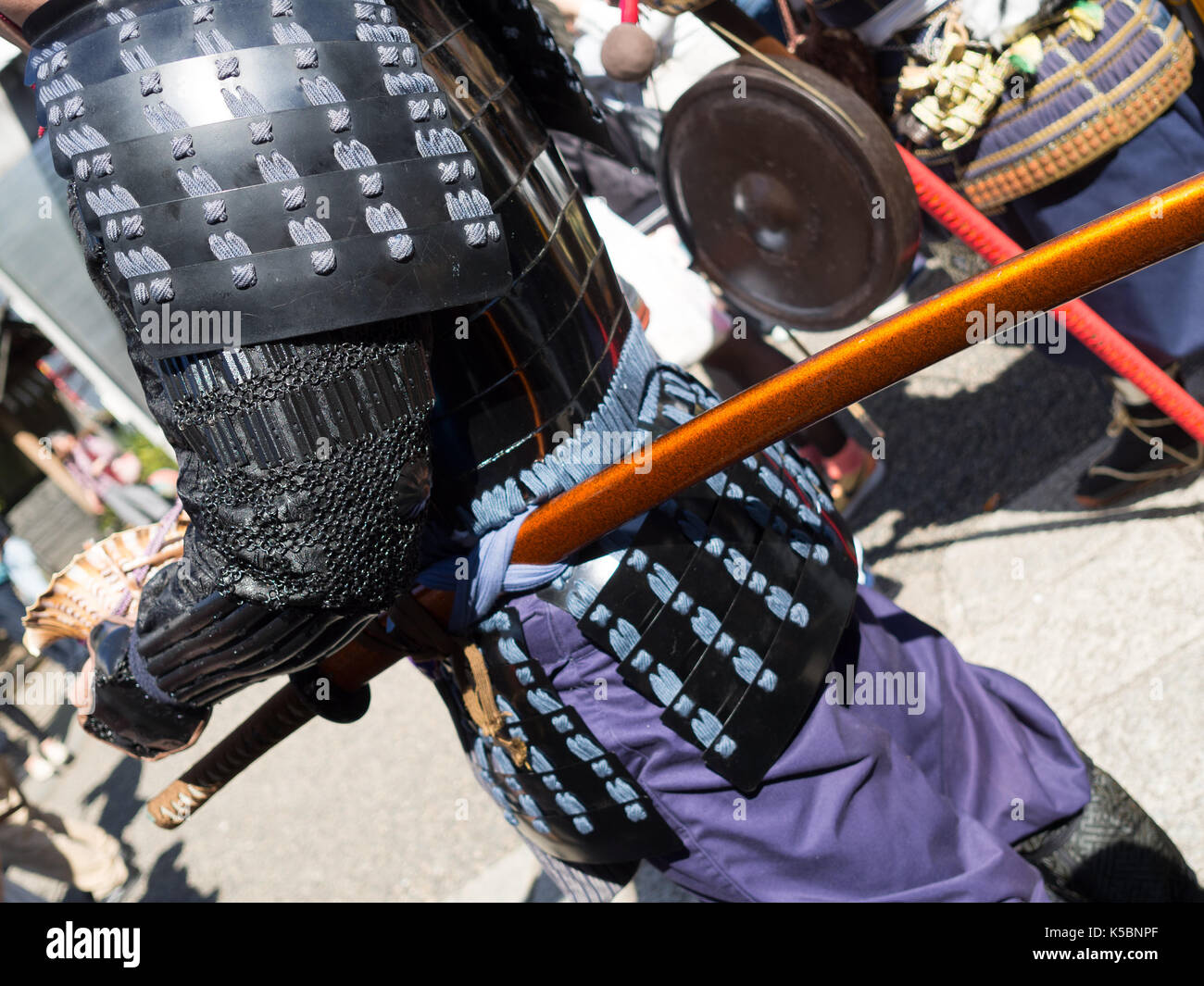 Close up of a wooden japanesse sword. in a parade in the streets of Japan Stock Photo