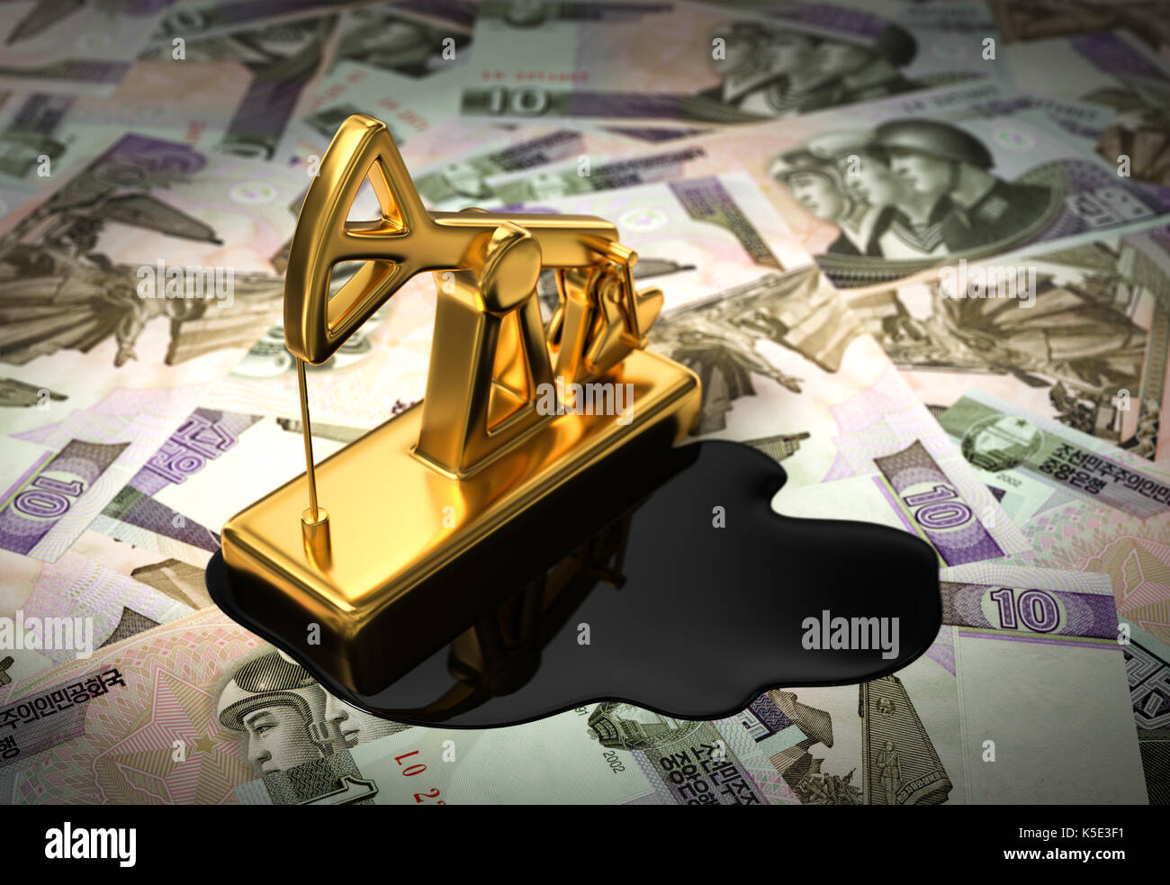 Gold Pumpjack And Spilled Oil On North Korean Wons. 3D Illustration. Stock Photo