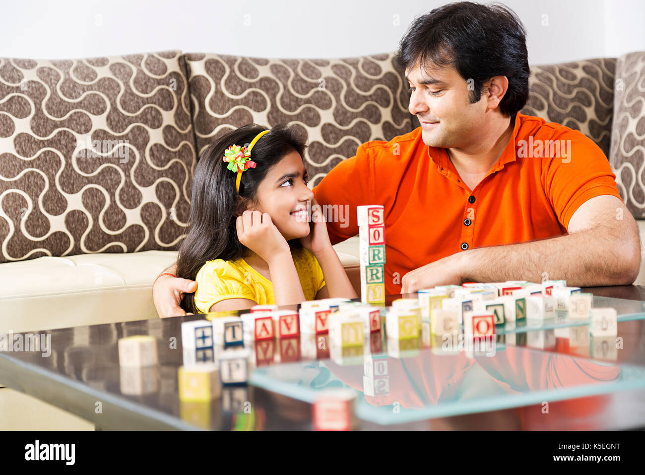 Indian Father Punishment Little daughter Educational Toys blocks At Home Stock Photo
