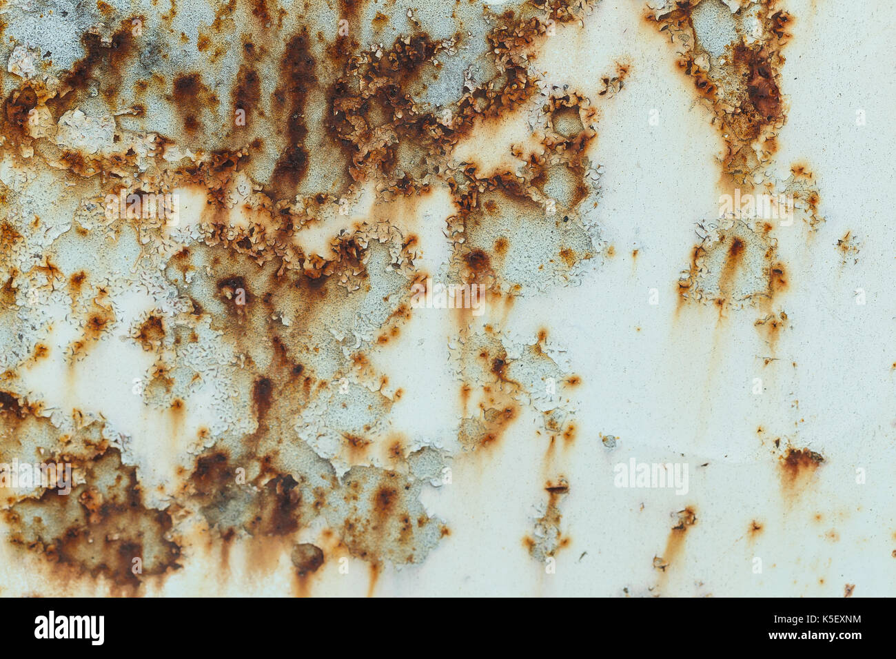 Rusted painted metal wall. Rusty metal background with streaks of rust ...